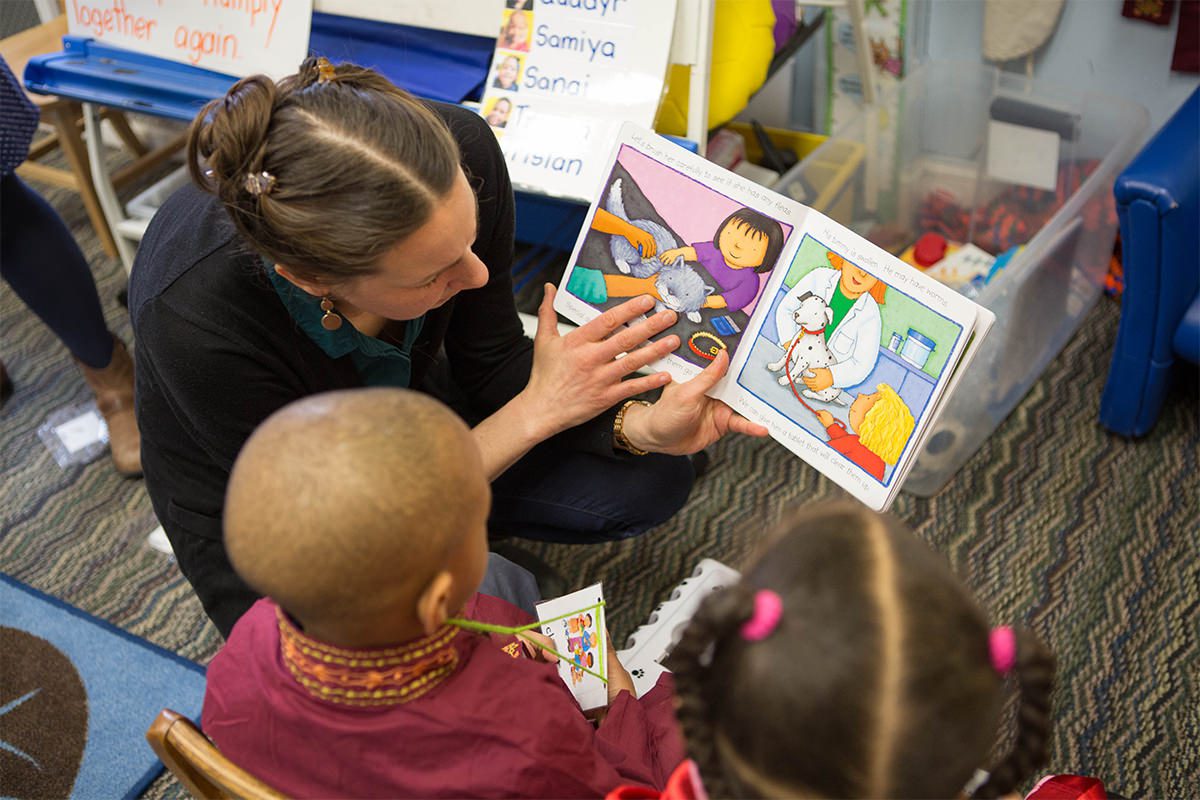 Kids Reading with Teacher